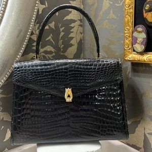 Black crocodile skin bag